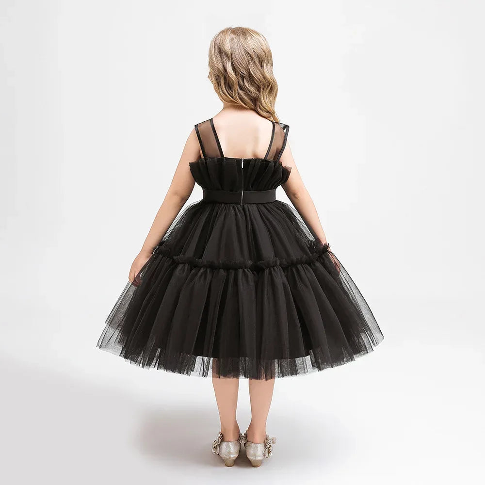 Girls black tulle occasion dress with ruffle details and sheer straps, size for kids
