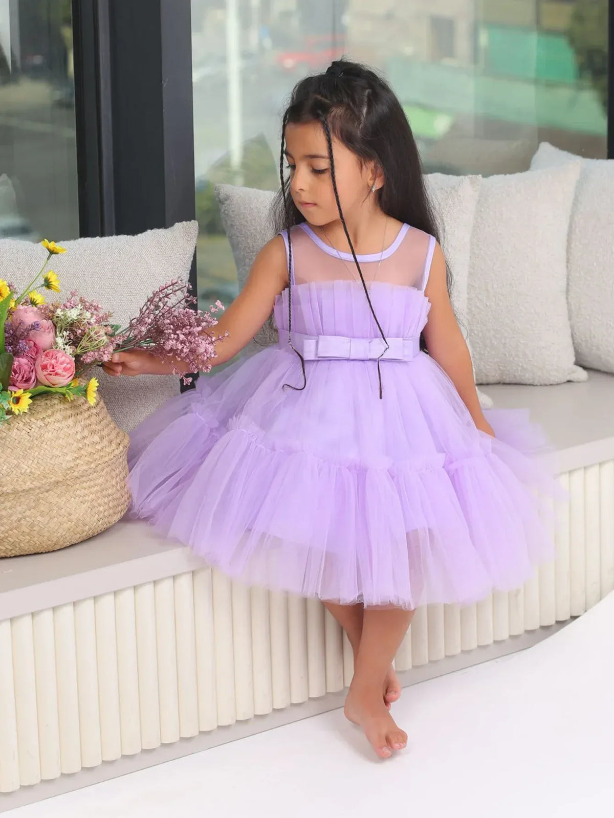 Lavender girls tulle occasion dress with sleeveless bodice and bow detail for toddlers
