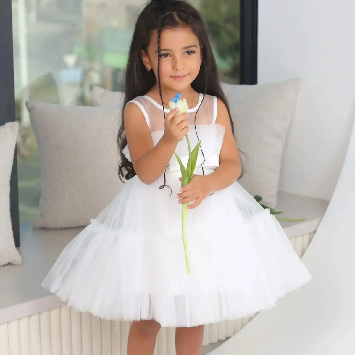 Girls white tulle occasion dress with sleeveless design for toddlers and young kids