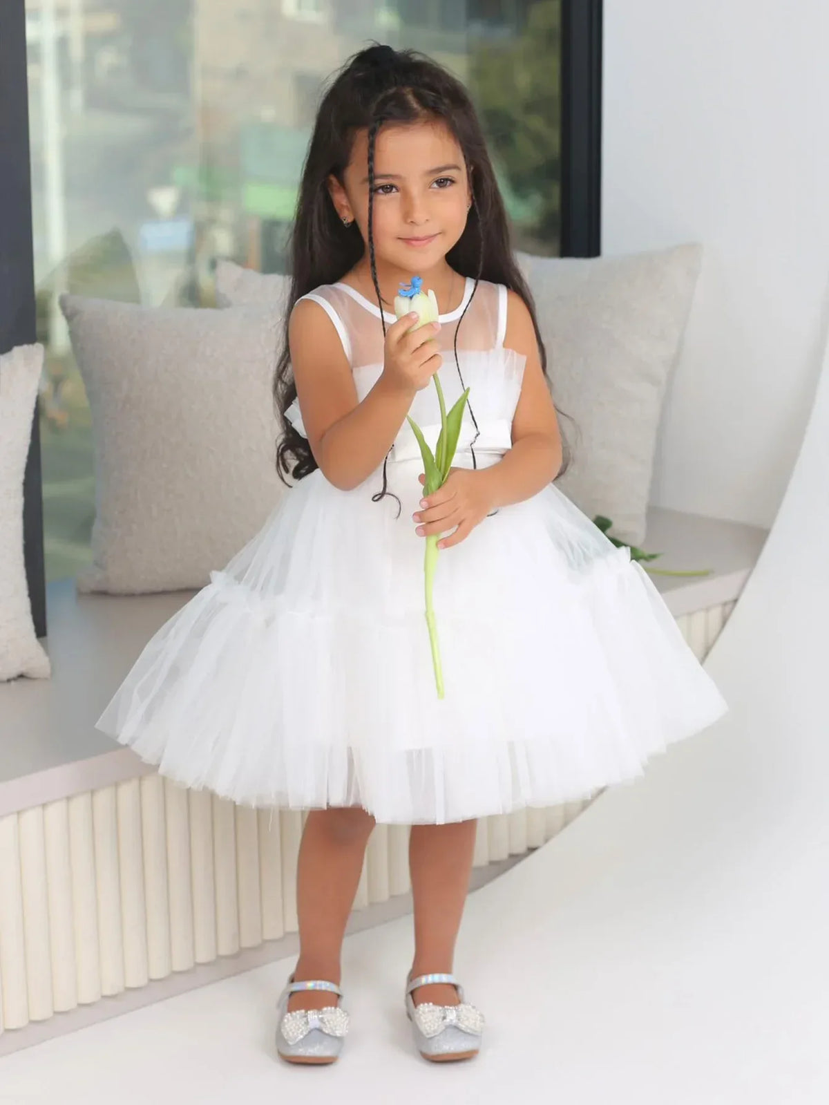 White girls tulle occasion dress with sleeveless design for young children