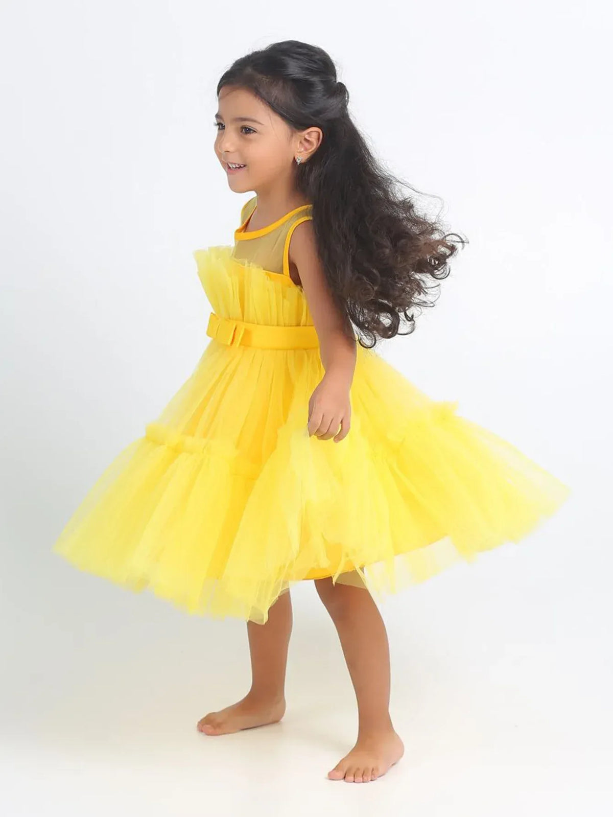 Yellow girls tulle occasion dress for toddlers with bow detail and sleeveless design