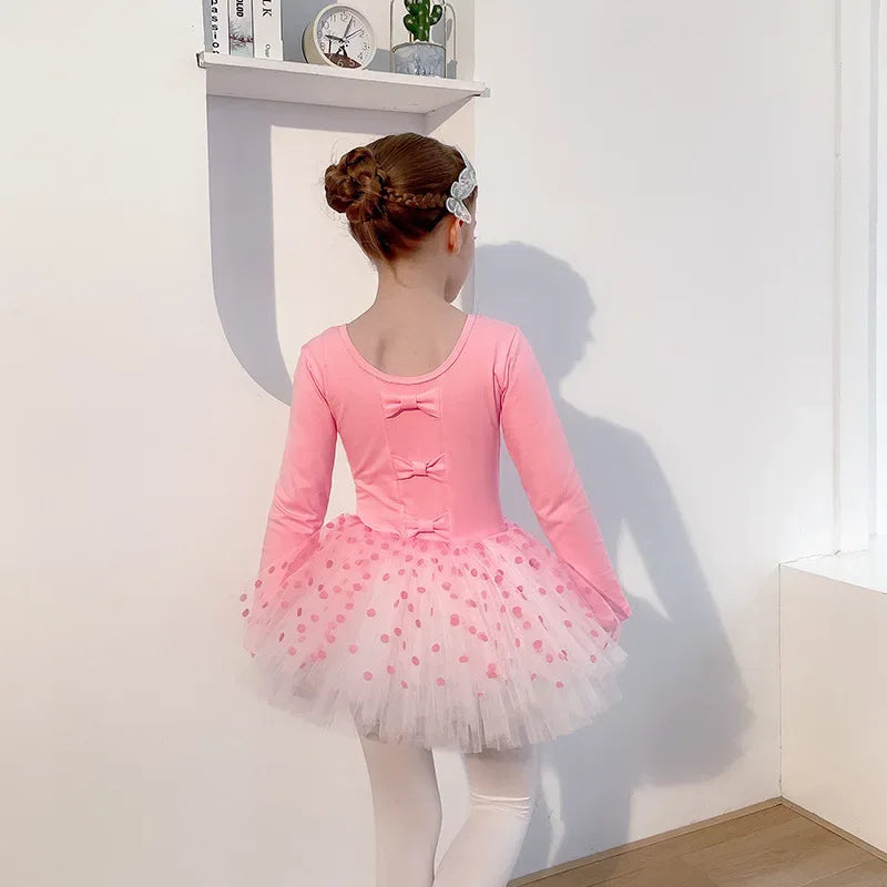 Girls pink long sleeve tutu dress with polka dot tulle skirt and bow accents for kids