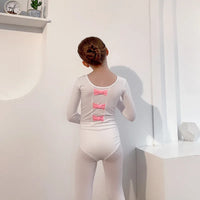 White girls tutu dress with long sleeves and three pink bows on the back for toddlers