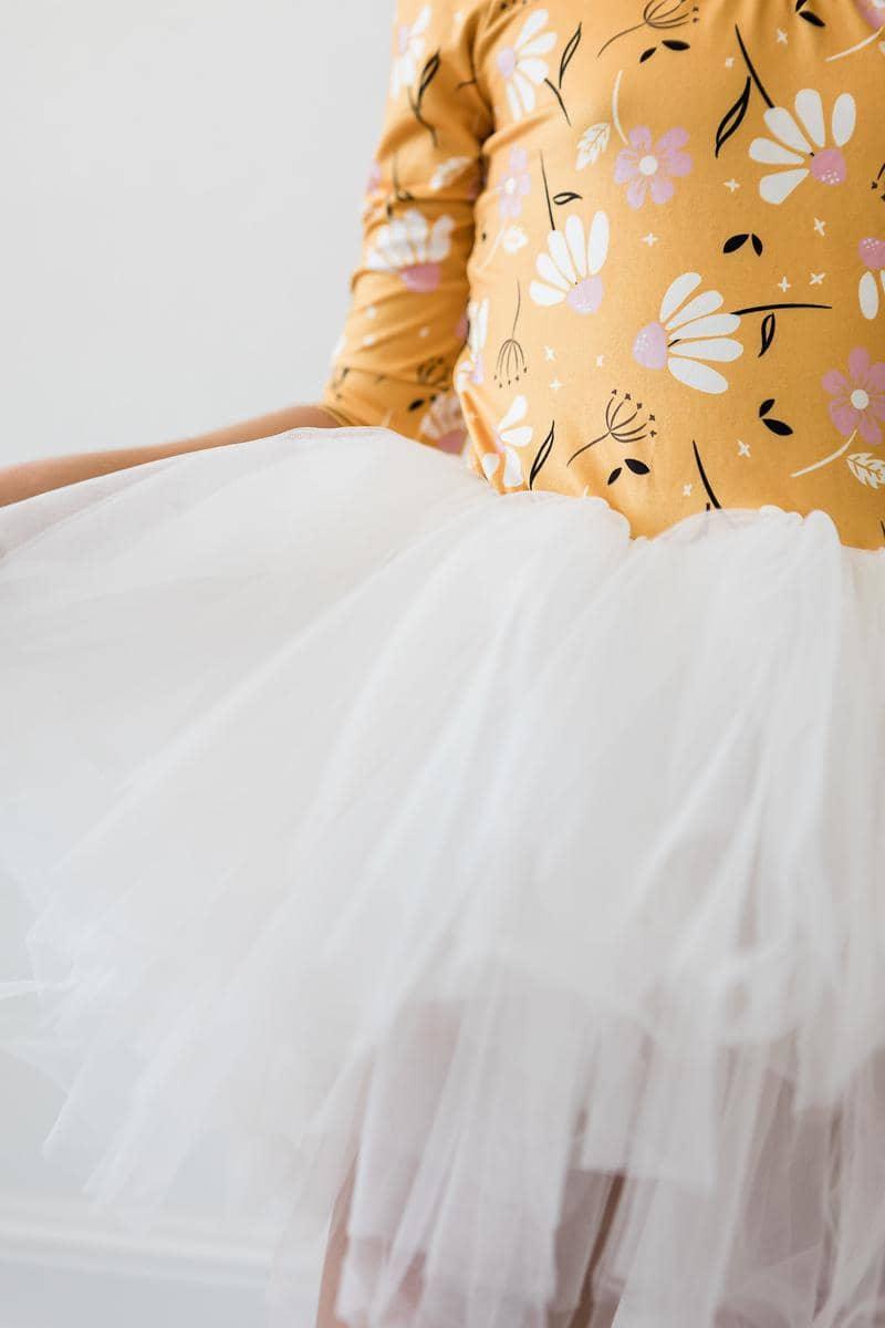 Girls white tutu leotard dance outfit with 3/4 sleeves and floral mustard yellow top for young dancers