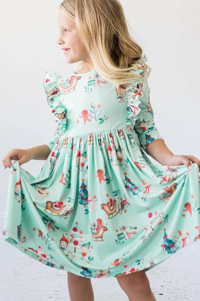 Girls mint green twirl dress with 3/4 sleeves and ruffle details, toddlers size with playful print
