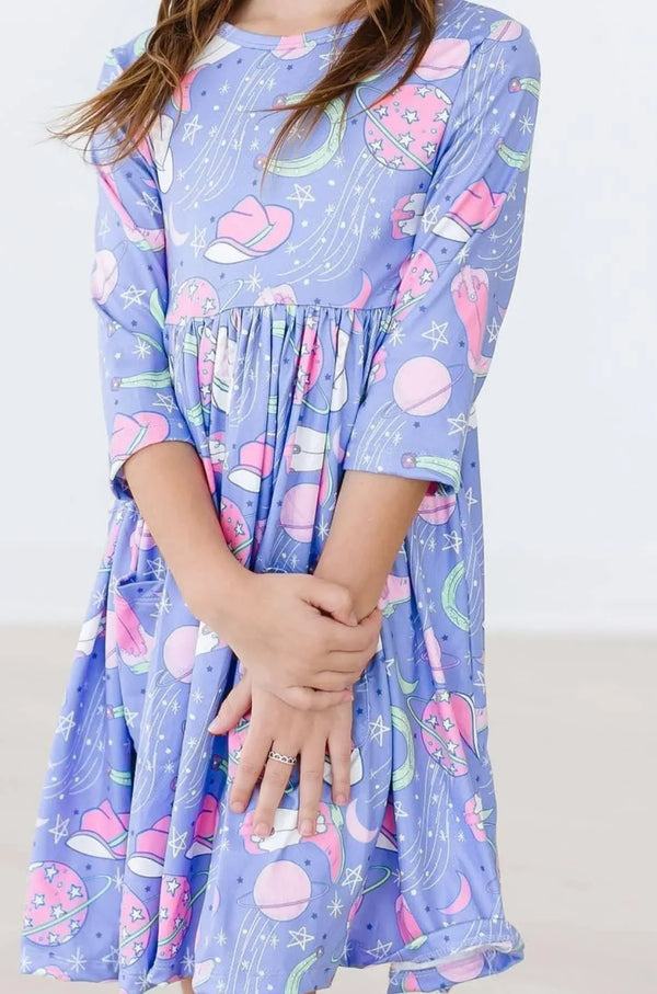 girls twirl dress in purple with sleeves featuring cowboy hat and planet prints