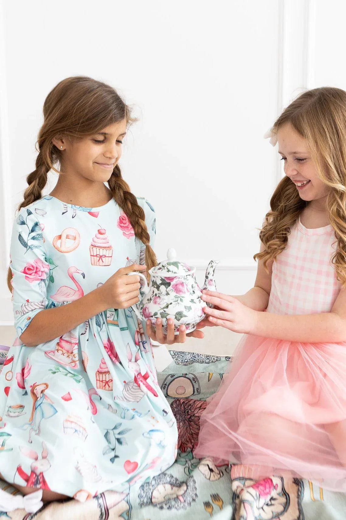 Girls light blue twirl dress with pockets featuring cupcakes and flamingos print in size for kids