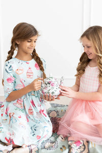 Girls light blue twirl dress with pockets featuring cupcakes and flamingos print in size for kids