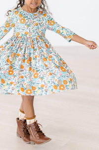 Girls vintage twirl dress with 3/4 sleeves in white floral print, toddler size with pockets