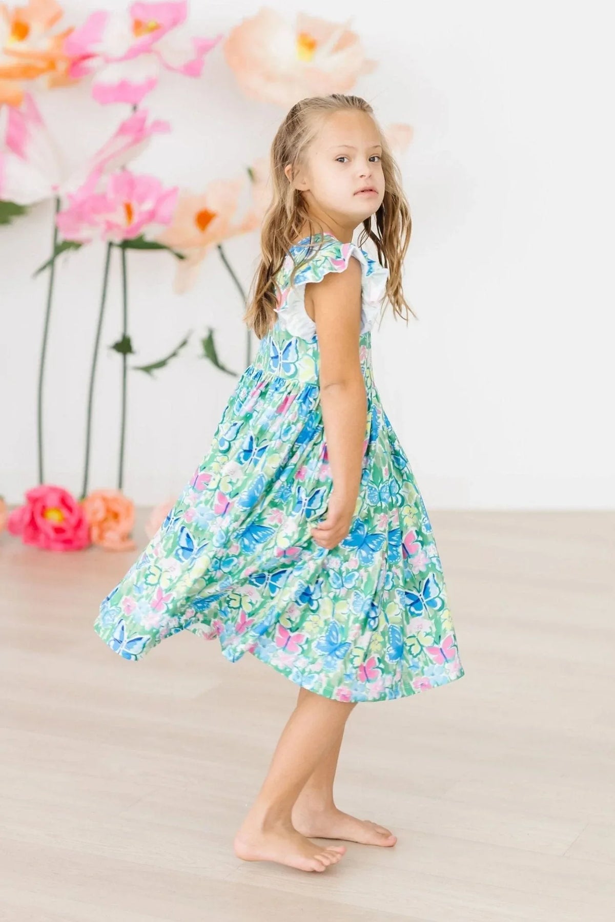 Girls watercolor butterfly dress by Mila & Rose, sleeveless twirl dress with flutter sleeves in blue and green floral print