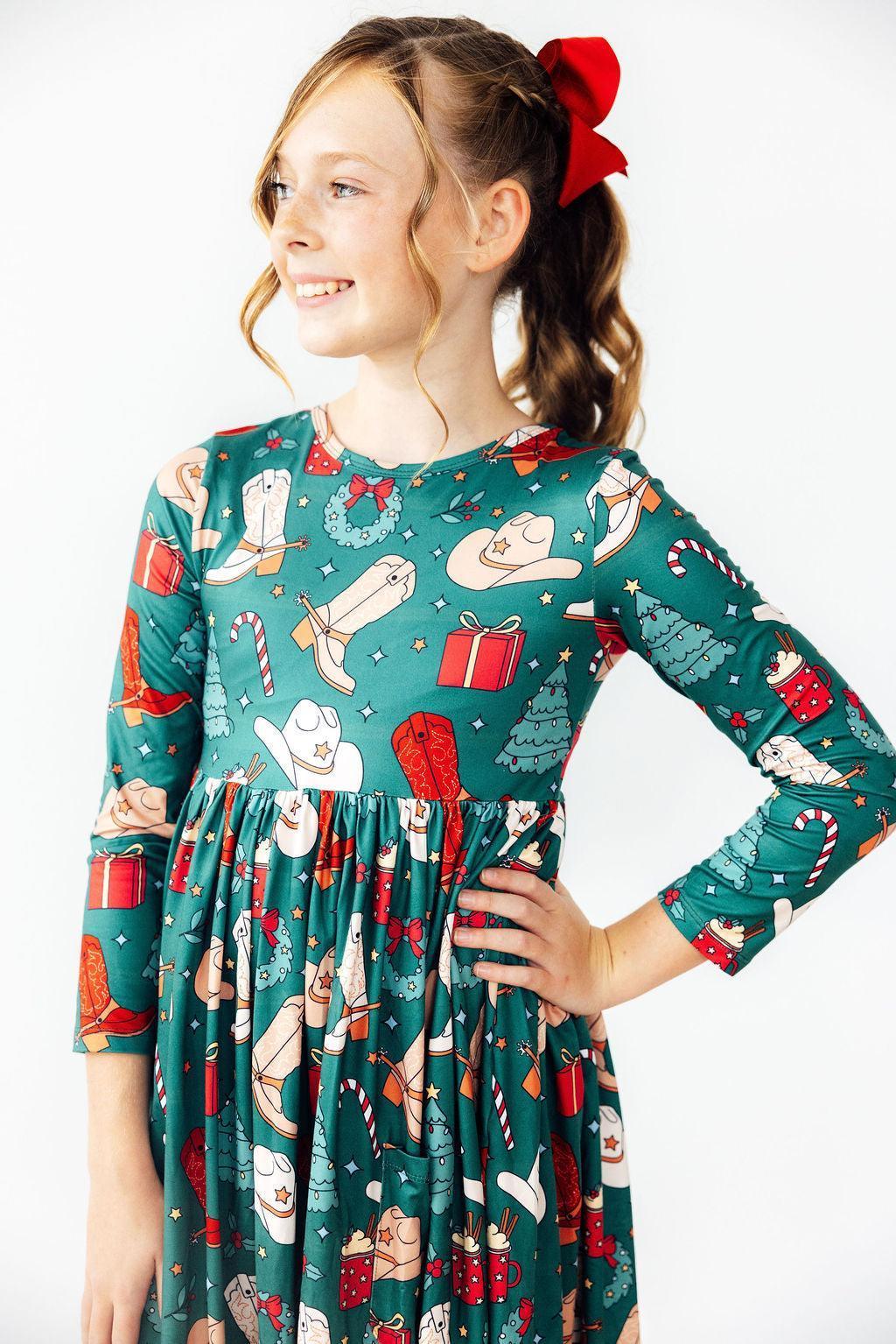 Girls green western themed twirl dress with long sleeves and festive holiday print