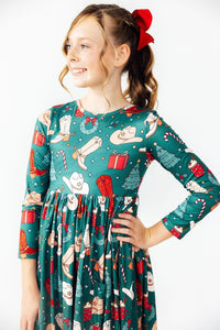 Girls green western themed twirl dress with long sleeves and festive holiday print