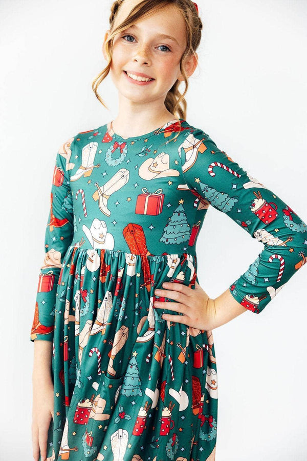 Girls green western themed twirl dress with long sleeves and festive holiday prints