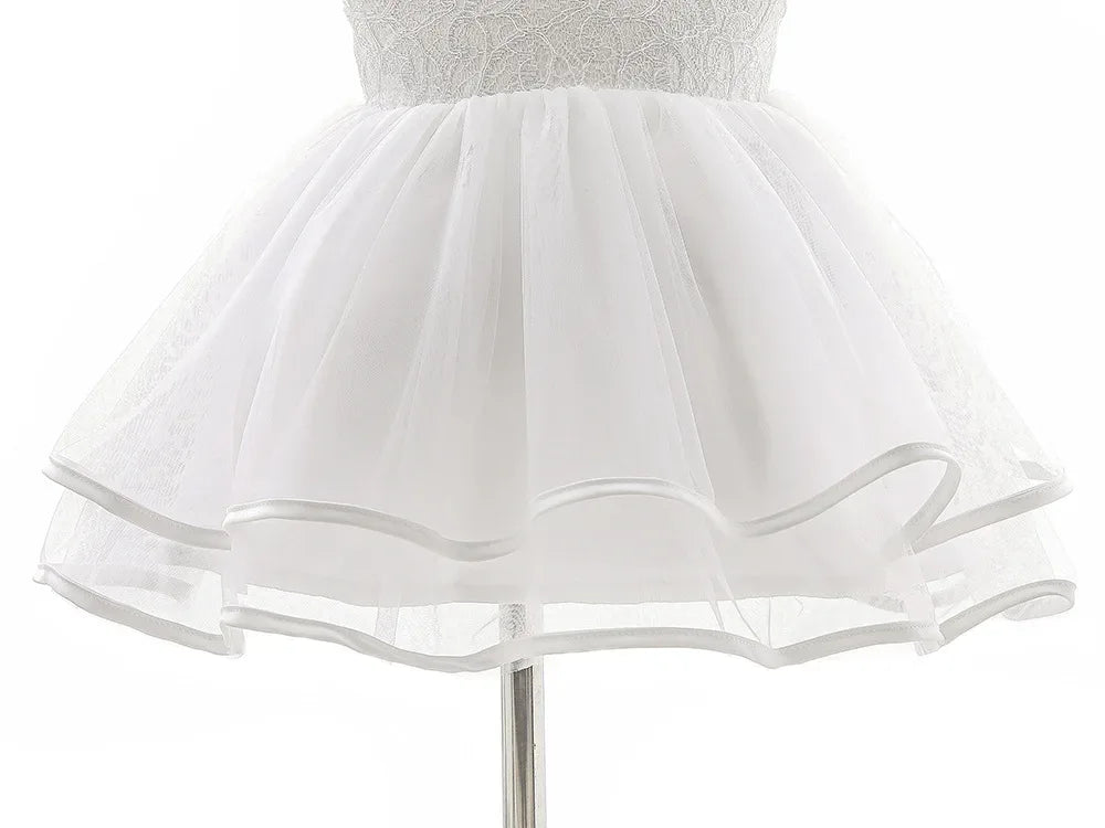 Girls white lace occasion dress for toddlers featuring a layered tulle skirt and delicate lace bodice