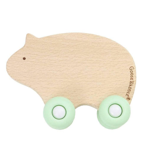 Goosewaddle silicone wood baby teether in light natural wood with pastel green silicone wheels