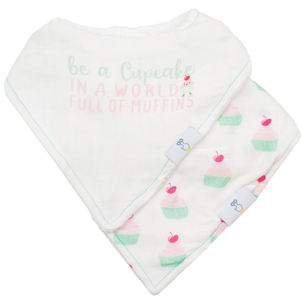 Muffin and Cupcake 2 Pack Muslin & Terry Cloth Bib Set featuring a cute design with the phrase 'be a Cupcake in a world full of muffins' and charming cupcake illustrations.
