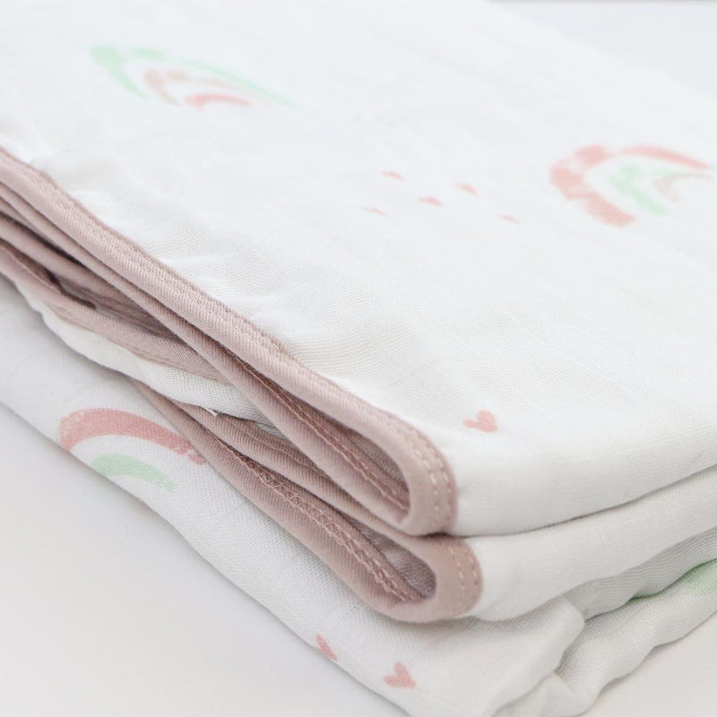 Close-up view of the Rainbow and Mauve Oversized Bamboo Muslin Quilted Blanket, highlighting the soft texture and adorable printed designs.