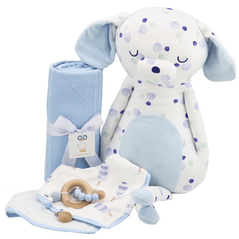 Blue Knit Blanket by Goosewaddle® displayed alongside a plush toy and other baby accessories, highlighting its ideal use for nurturing comforts.
