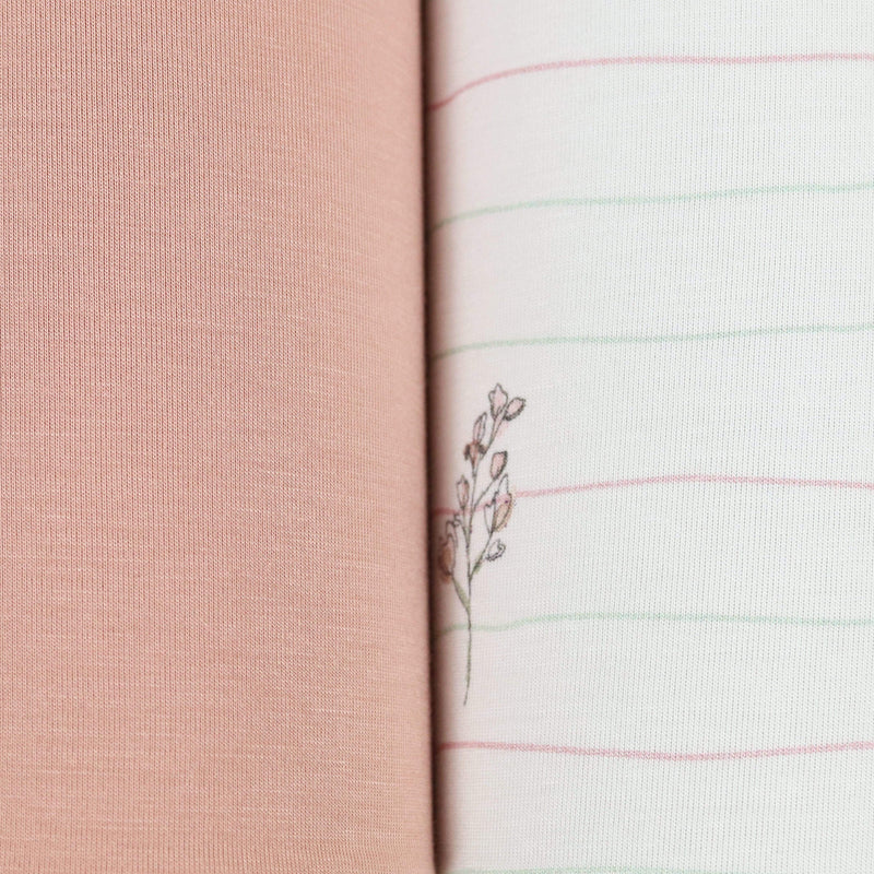 Detailed image of the Flower and Pink 2 PK Swaddle Blanket set, featuring a solid soft pink fabric next to a white blanket with gentle striped patterns and floral embroidery.