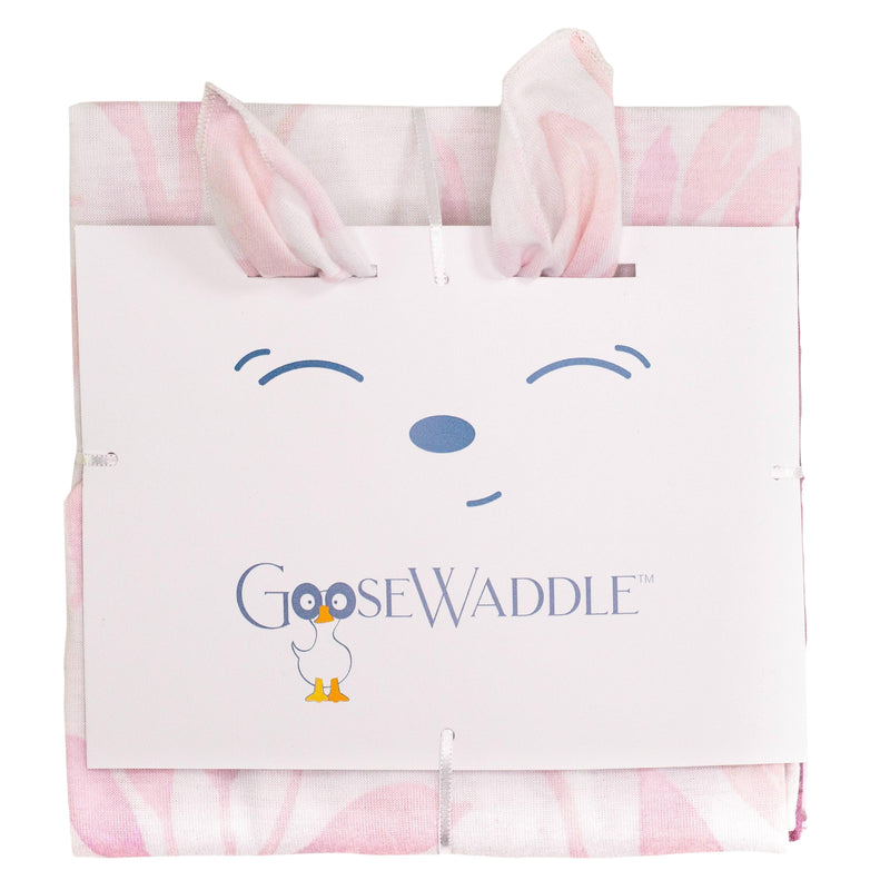 Close-up of the Poppy Elephant/ Leaves Pink 2 Pack Newborn Receiving Blanket packaging, showcasing a cute bunny-eared design on the label, ideal for delightful gifting for new parents.