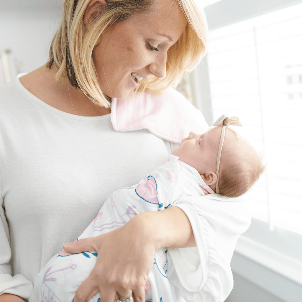 2 PK Newborn Receiving Blankets: A happy moment between a mother and her baby, showcasing the soft, cozy feel of the blankets by Goosewaddle, ideal for swaddling and nurturing.