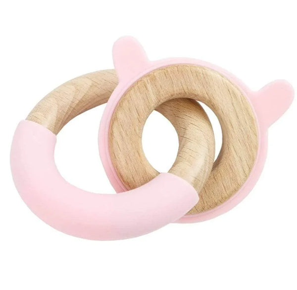Pink bunny baby teething toy made of natural wood and soft pink silicone for newborns