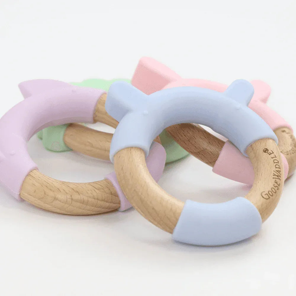 Pink bunny teether made of natural wood and soft silicone for soothing babies