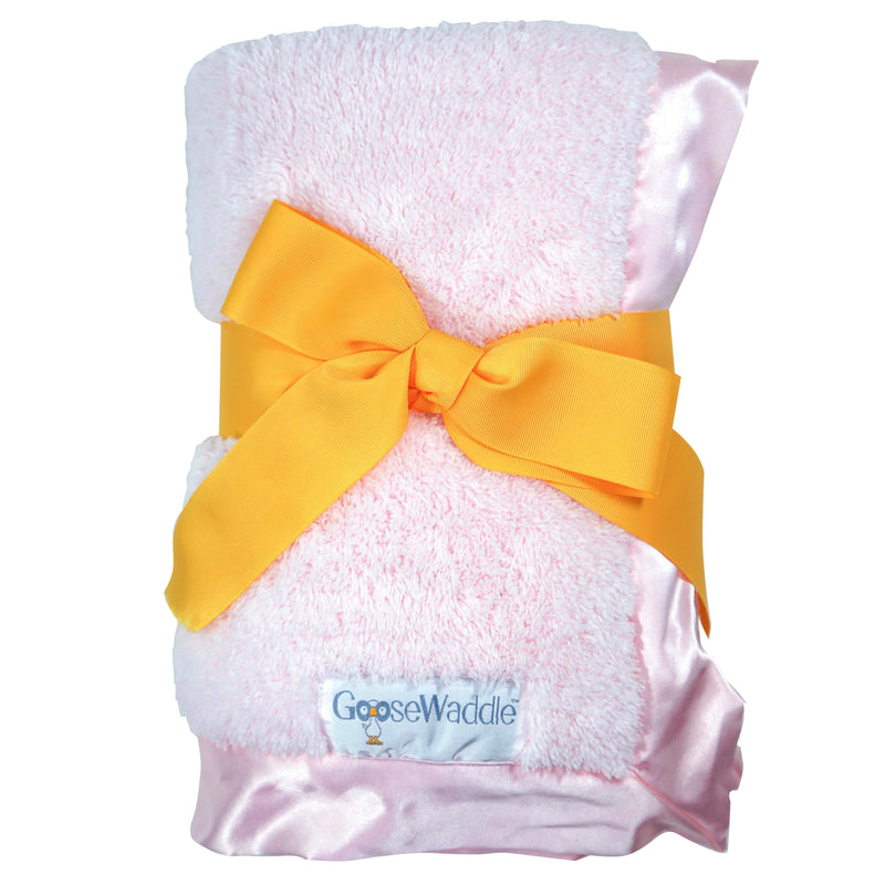 GooseWaddle Luxury Blanket in gentle pink, beautifully presented with a yellow ribbon and satin trim, perfect for infant snuggles.