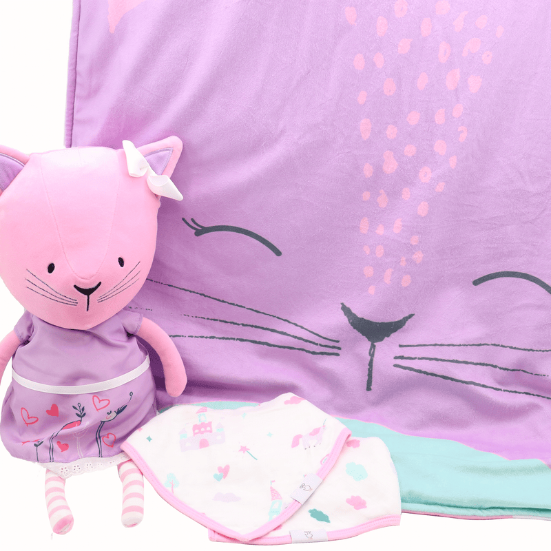 Lucy Kitty Plush Doll with Dress displayed alongside a cozy blanket and bib, highlighting the adorable character and children's play items by Goosewaddle.