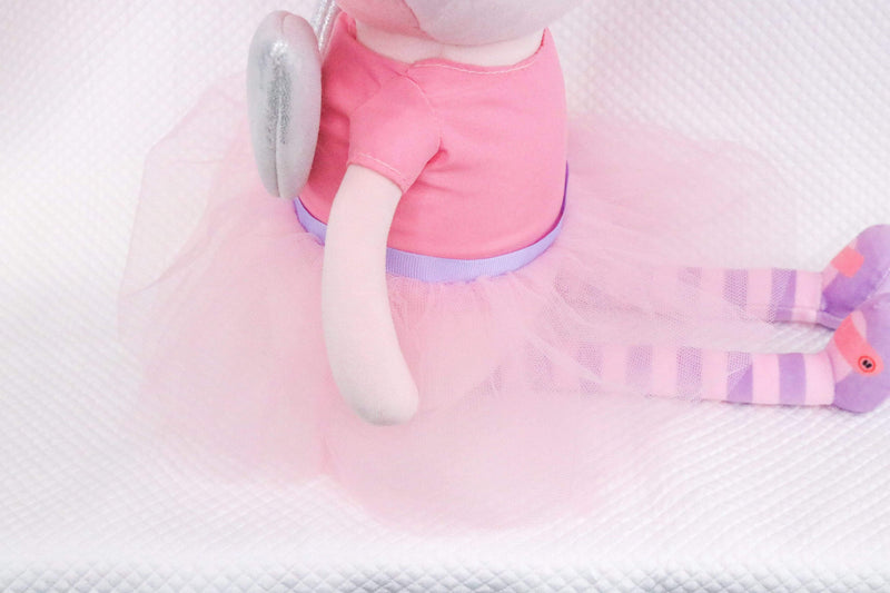 Side view of the Meg Fairy Plush Doll with Dress and Wings, showcasing its soft pink tutu, striped legs, and shimmering wings, perfect for imaginative play and snuggles.