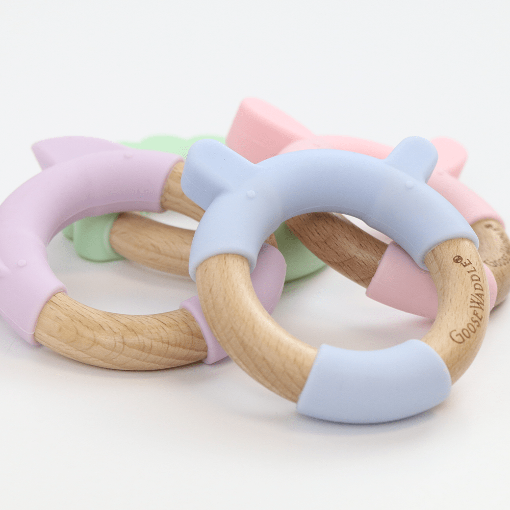 Goosewaddle silicone teether toys in pastel colors for infants with wooden ring and soft silicone ears