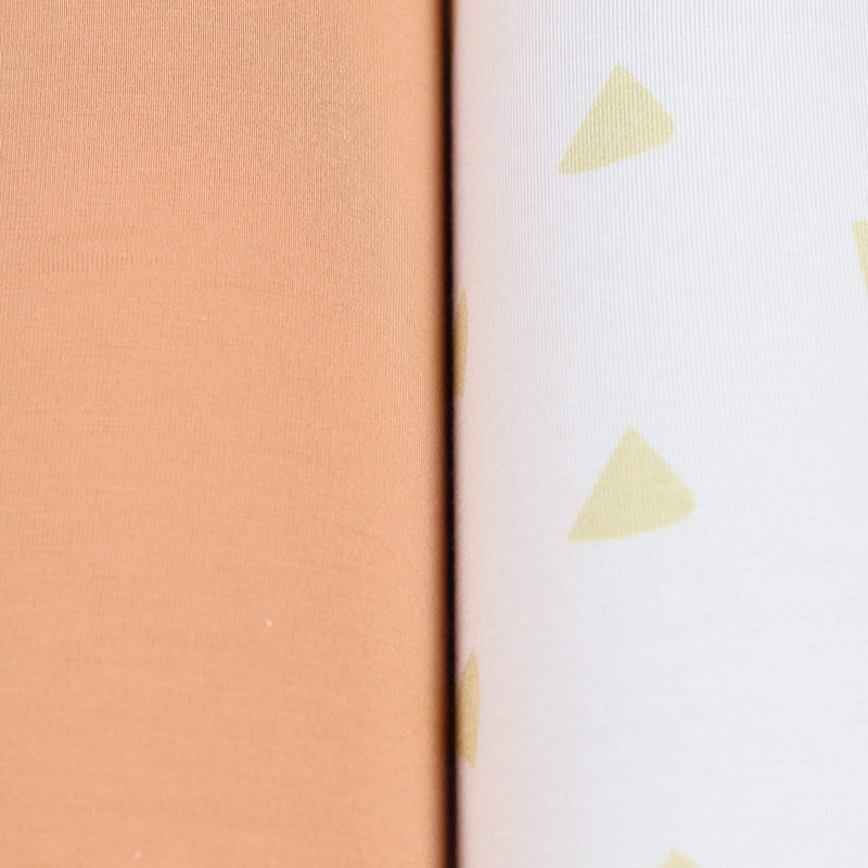 Close-up view of the Tan Triangle and Terra Cotta 2 PK Swaddle Blanket set, showcasing the soft textures of the terra cotta and patterned blankets, perfect for newborn comfort.