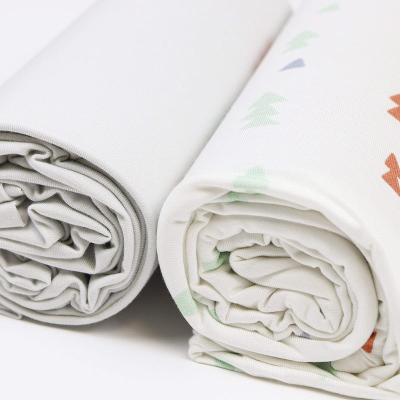 Close-up view of the rolled-up Triangles and Gray 2 PK Swaddle Blanket, highlighting the soft, breathable fabric in a stylish design.