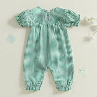 Green check smocked romper for babies made of soft cotton with puff sleeves and elastic cuffs