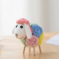 Colorful handmade sheep nursery decor for kids and babies with pink head and multicolor wool body