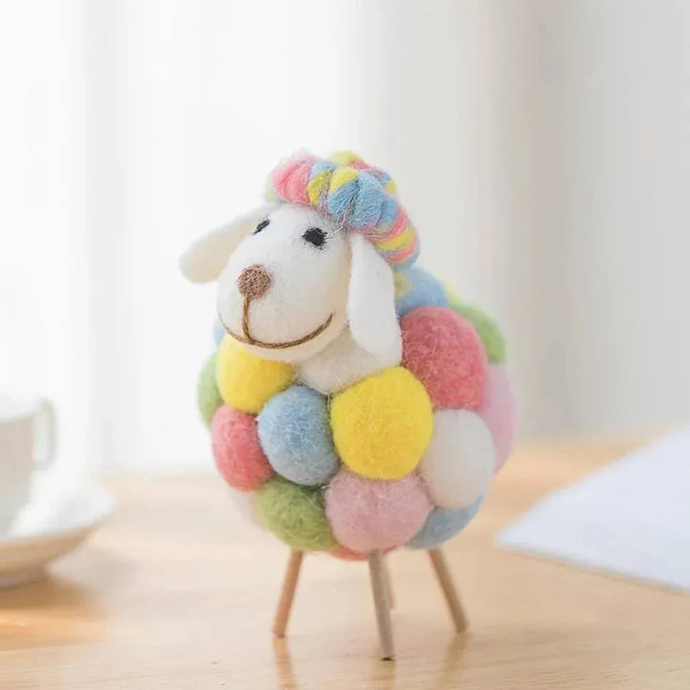 Colorful handmade sheep Nursery Decor with soft pastel pom-poms standing on wooden legs for kids and babies
