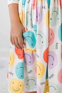  happy face pocket twirl dress for girls with colorful smiley face print and 3/4 sleeves