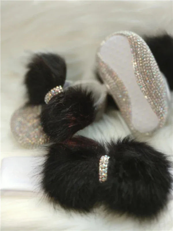 black fluffy headpiece set for babies with sparkling rhinestone accents and soft white band