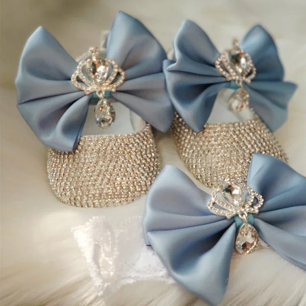 sparkling silver baby shoes and matching blue bow headpiece set for babies with crystal crown embellishments