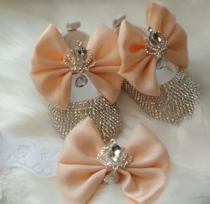 peach headpiece set for babies with large bows and rhinestone crown embellishments