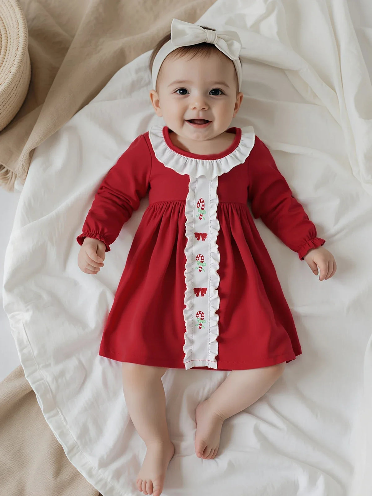 Red holiday baby dress with candy canes long sleeve for infants with white ruffle detail