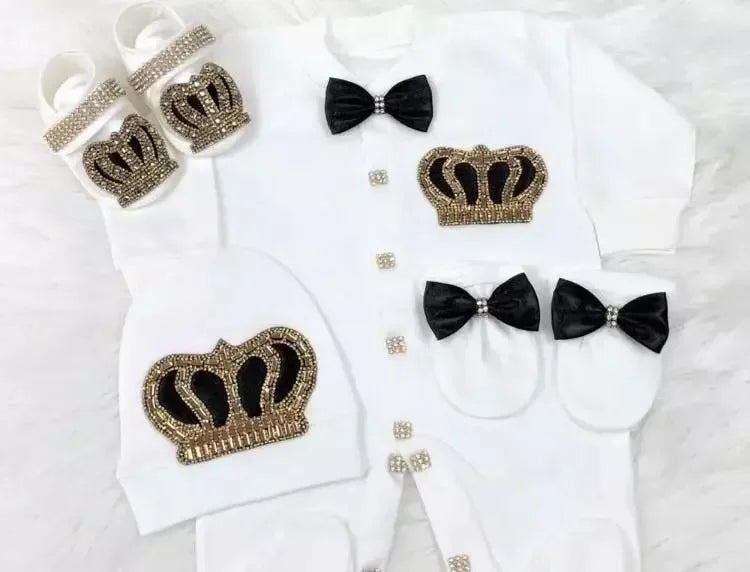 white homecoming baby outfit set with black and gold crown details, black bows, and matching hat and booties for newborns
