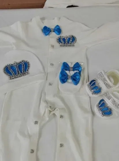 White homecoming baby outfit set with blue crown embellishments and blue bows for newborns