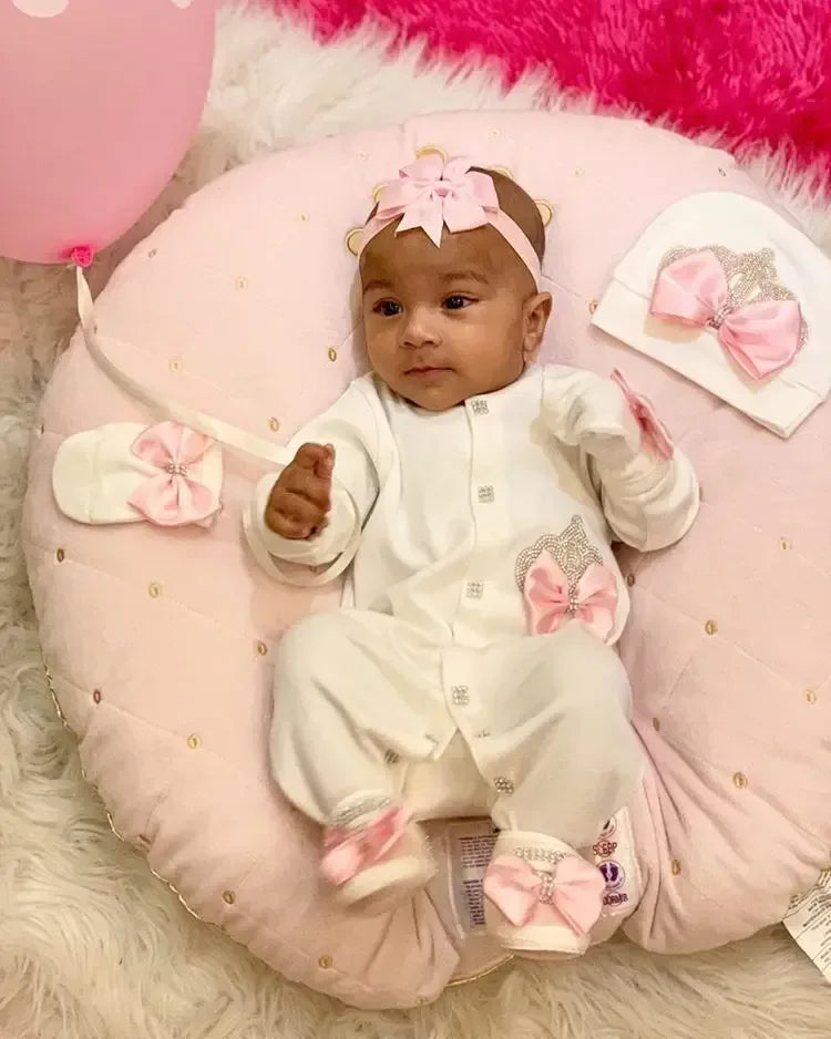 Newborn white homecoming baby outfit set with pink bows and matching hat for infants