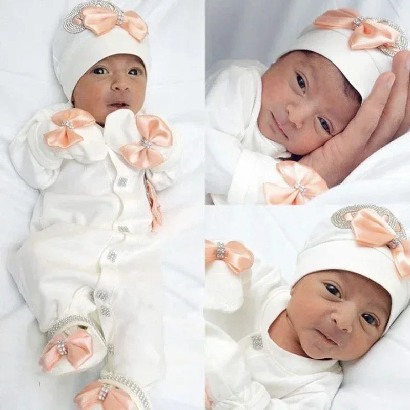 Newborn white homecoming baby outfit set with peach satin bows and rhinestone accents