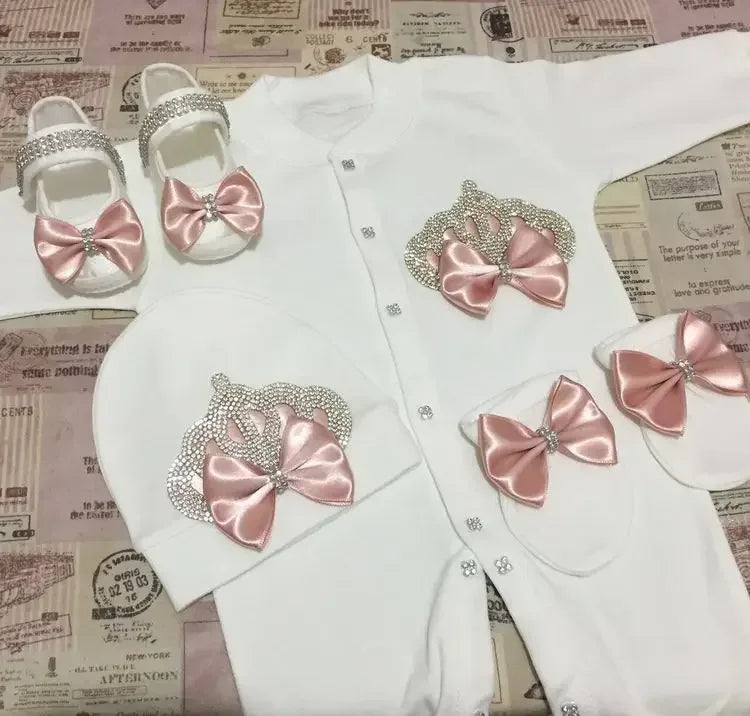 White homecoming baby outfit set with pink satin bows and rhinestone crown details for newborns