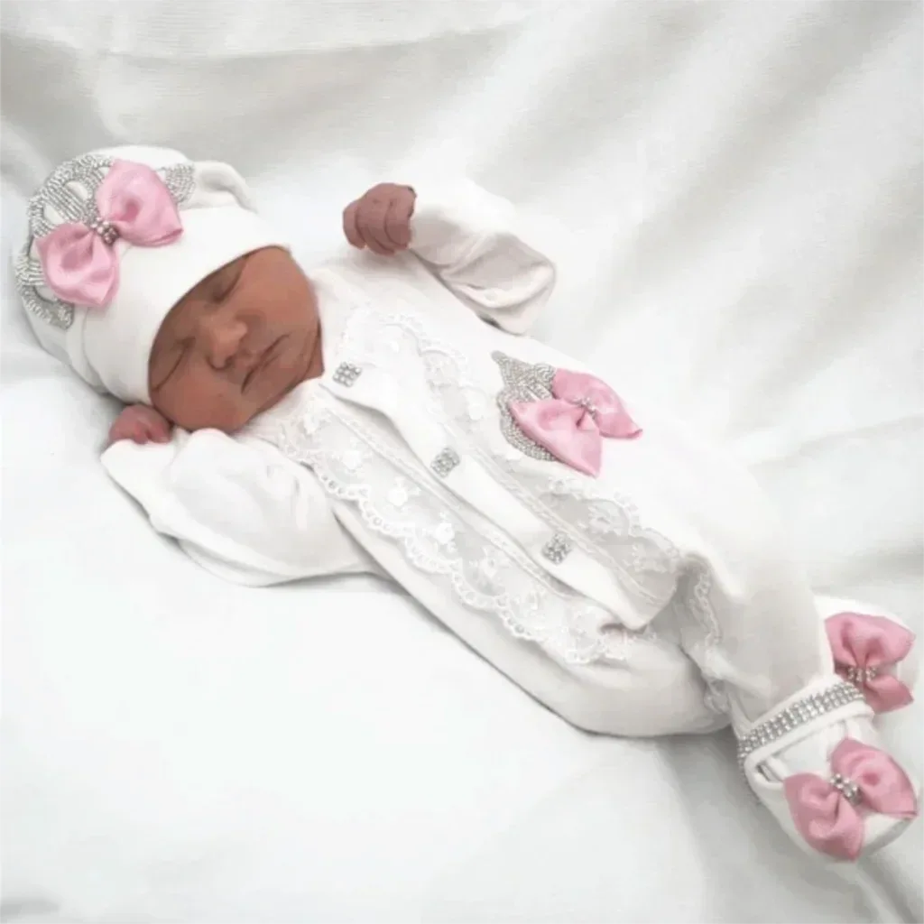 white newborn homecoming baby outfit set with pink bows and rhinestone details