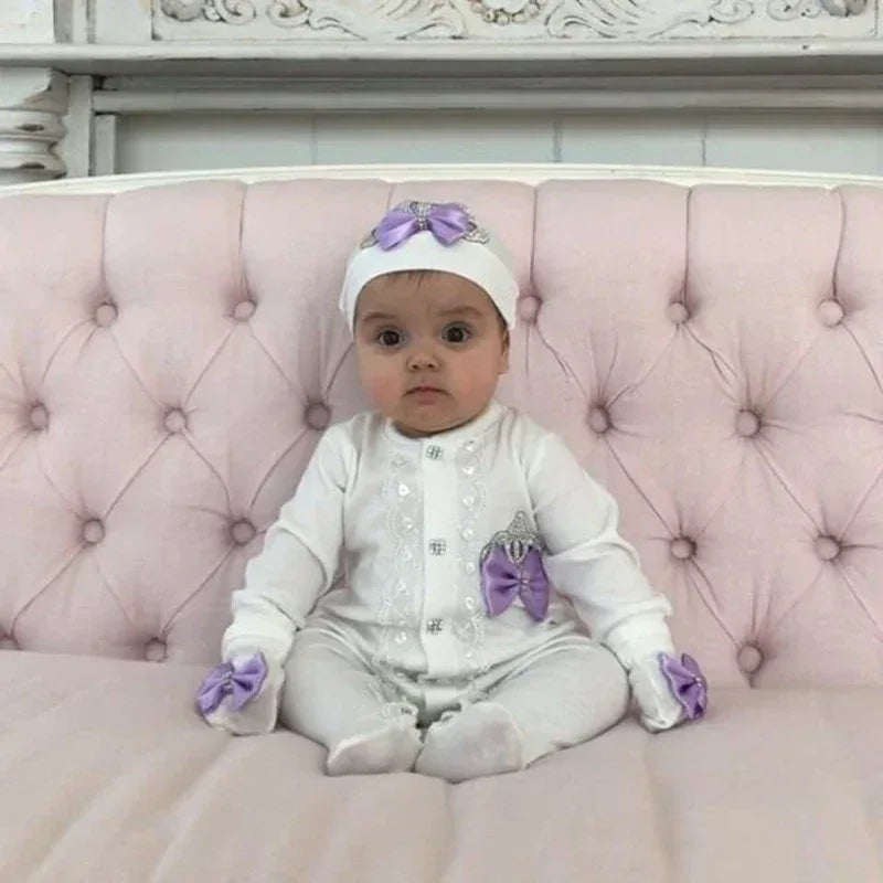white homecoming baby outfit set for 0 to 6 months with purple bows and button details