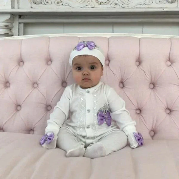 white homecoming baby outfit set for 0 to 6 months with purple bows and button details