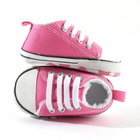 hot pink baby walking shoes with white laces and soft sole for infants